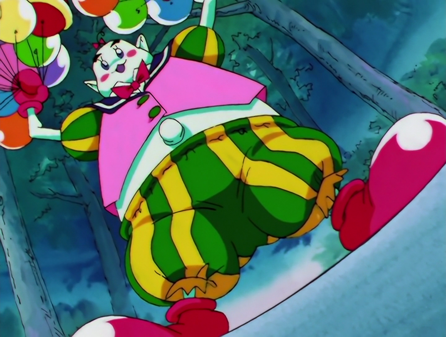 Sailor Amuse, a Phage from Sailor Moon episode 190. He’s a fat, clown-like guy with completely white skin. He’s wearing an ill-fitting pink shirt that shows off his bellybutton, and green and yellow striped pants with red clown shoes. He has a sailor color and is holding colorful balloons.